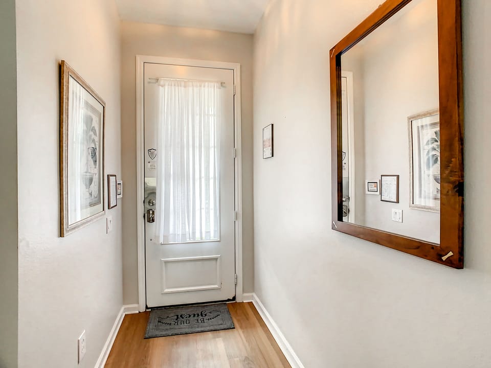 Welcoming entryway with natural light and modern decor.