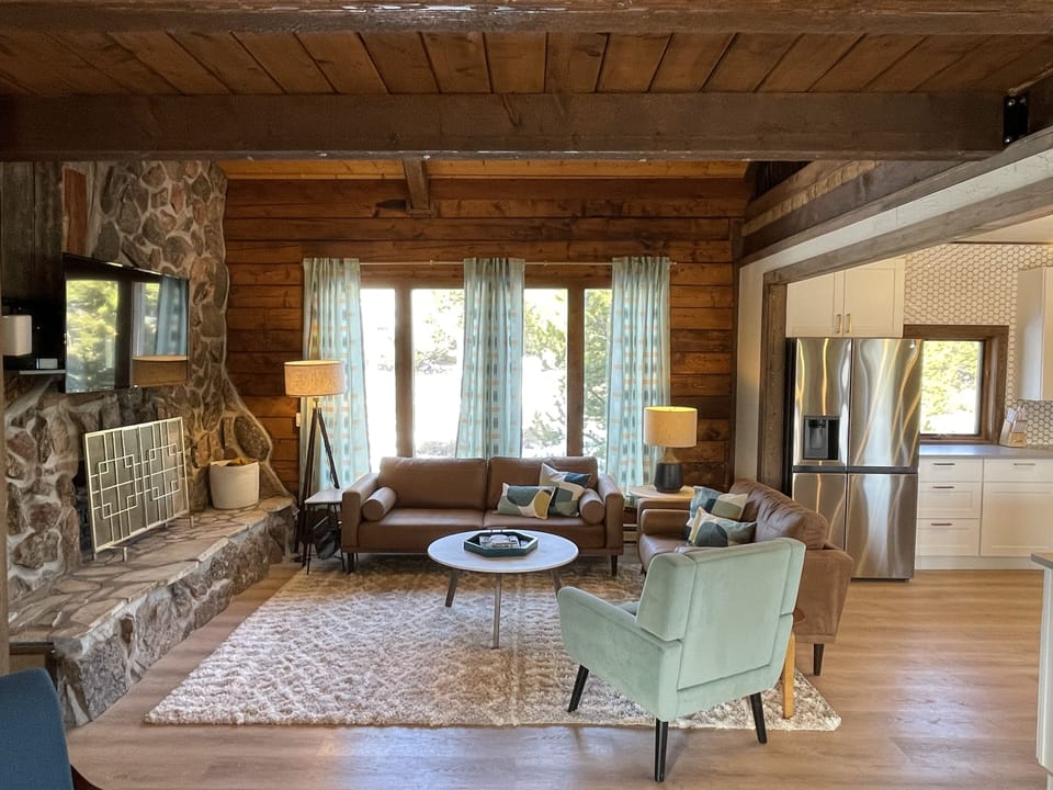 Living room, complete with floor to ceiling windows to catch rays and wildlife! 