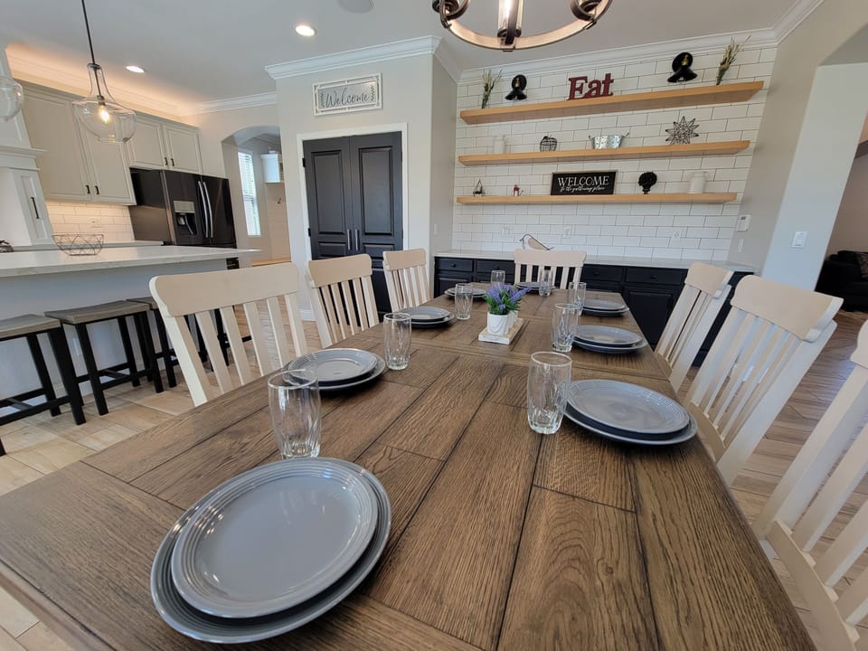 Fully stocked Kitchen along with table seating for many.