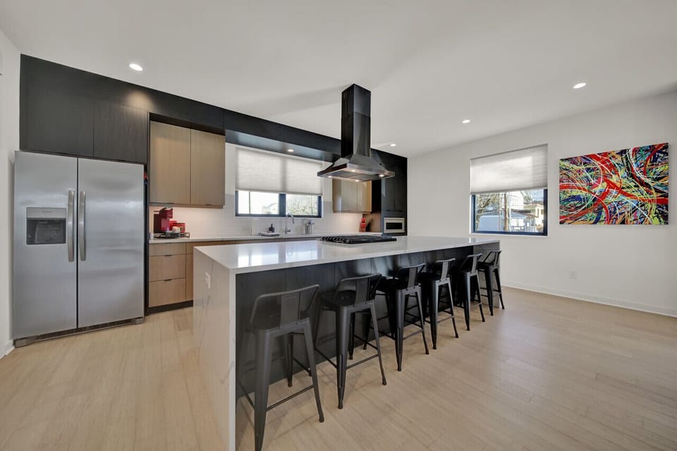 Once your kitchen creations are made and prepared, be sure to enjoy them on the large kitchen island with bar style seating for 6 people. Enjoy!