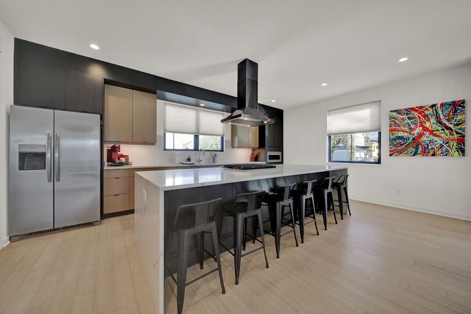 Once your kitchen creations are made and prepared, be sure to enjoy them on the large kitchen island with bar style seating for 6 people. Enjoy!