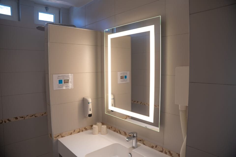 Freshen up in the bathroom after a day of adventure.