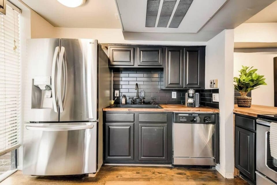 Spacious kitchen with sleek, modern appliances, fully equipped for all your cooking and dining needs.