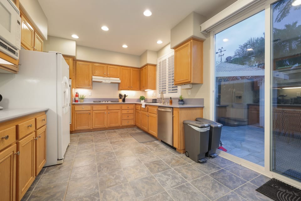 This fully-equipped kitchen has everything you need. You can see into the living room and dinning area while cooking.