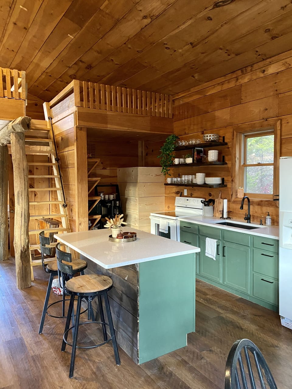 Kitchen, pantry and coffee area, and ladder stairs to the loft 