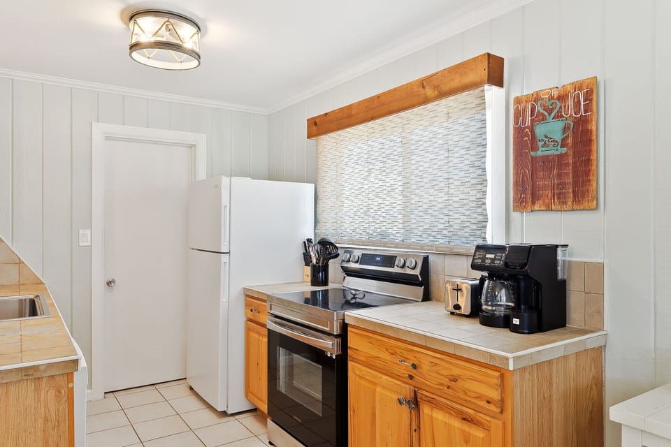 Kitchen is newly remodeled and is fully stocked with pots, pans and dishware needed for your home cooked meals.