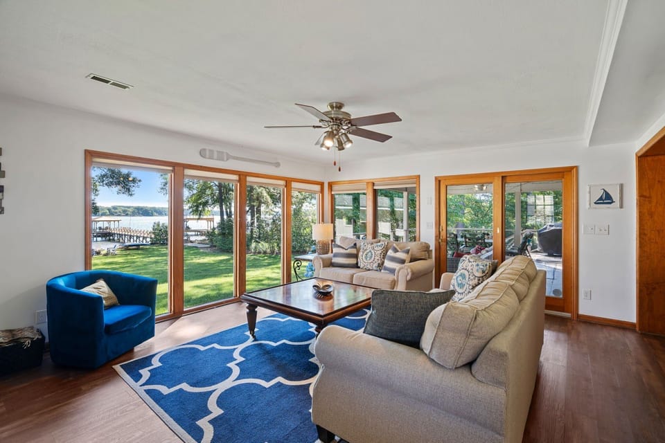 Main level living room with all of windows.
