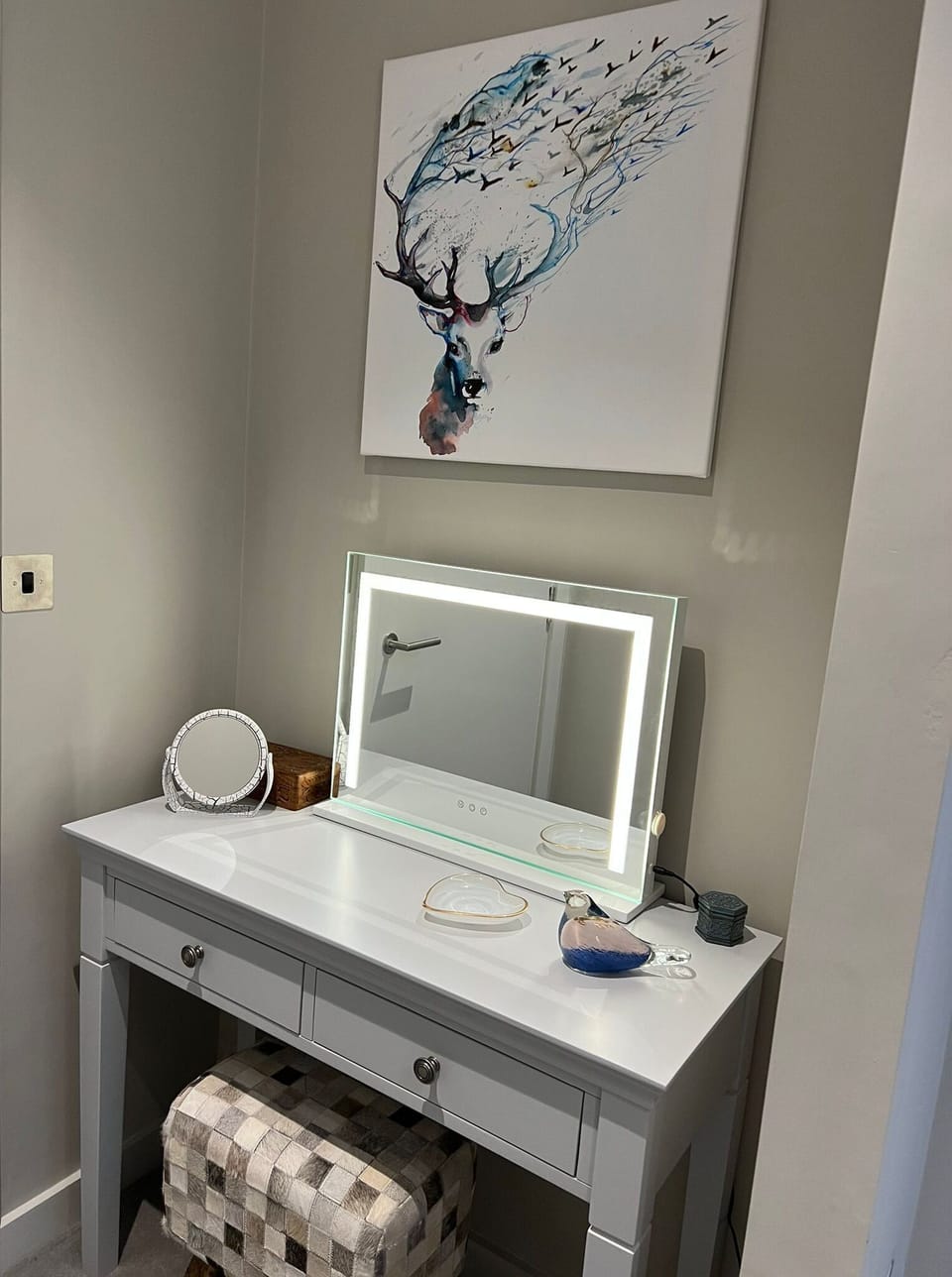 Dressing table and stool situated within the bedroom
