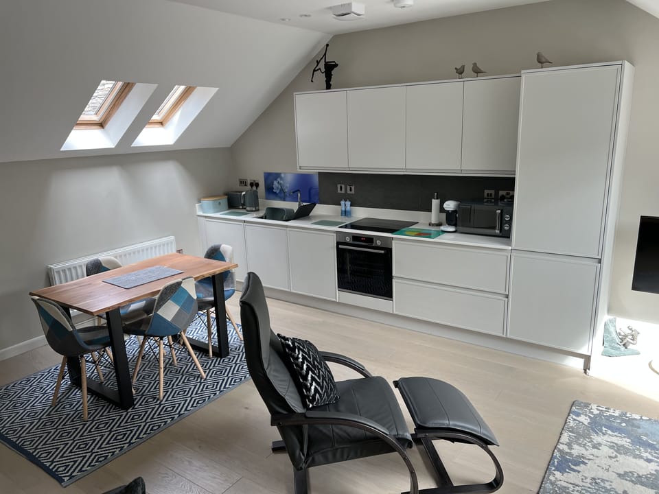 View from the living room to the dining/kitchen area.