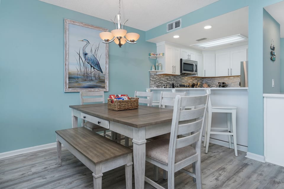 Gather around your coastal dining table where ocean-inspired decor and modern comforts create the perfect setting for memorable meals together.