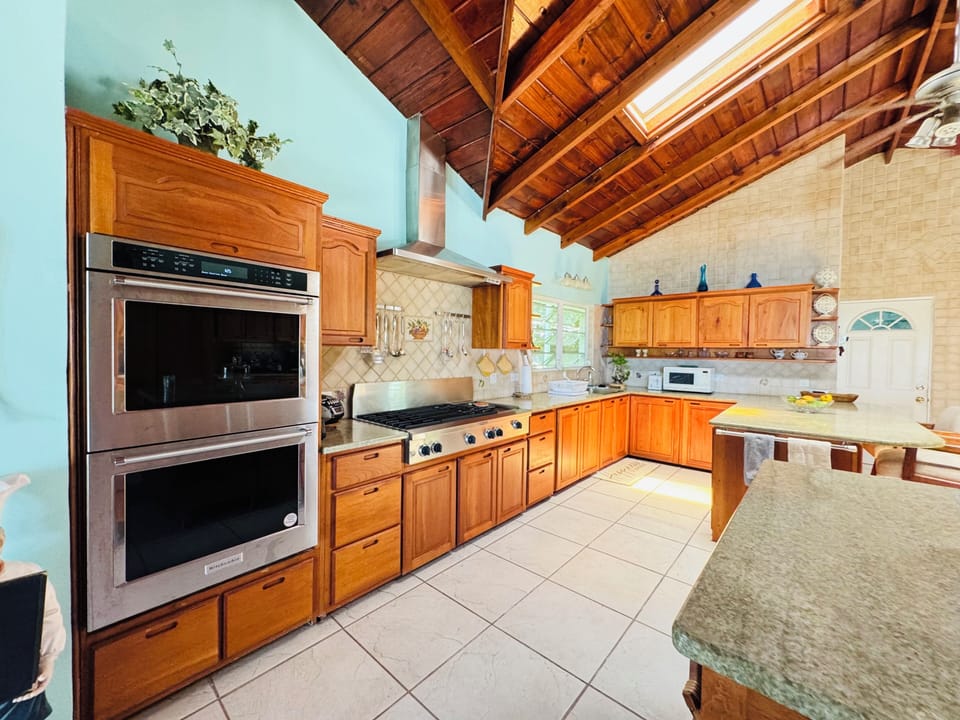 Double oven , stove  with built in grill and gridle, double sink both side of RM