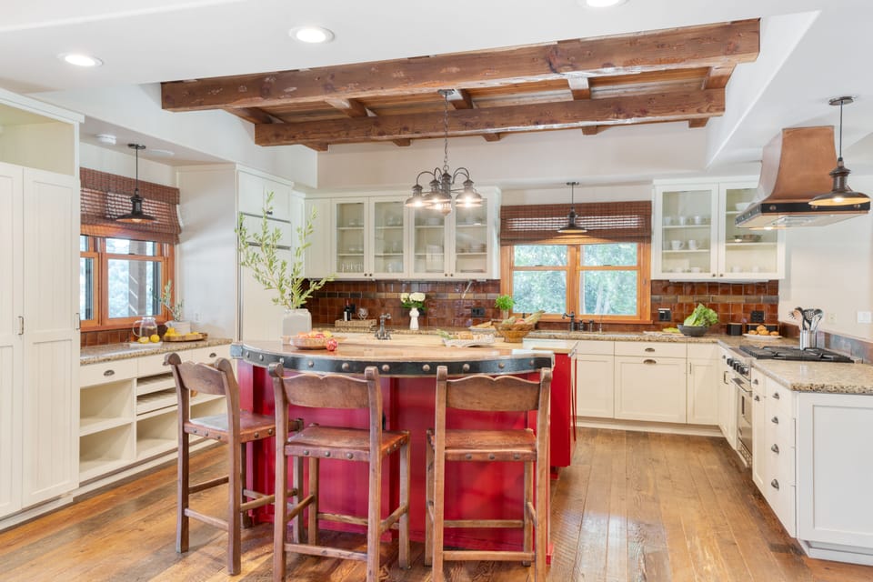Chic kitchen with an island and barstool seating.