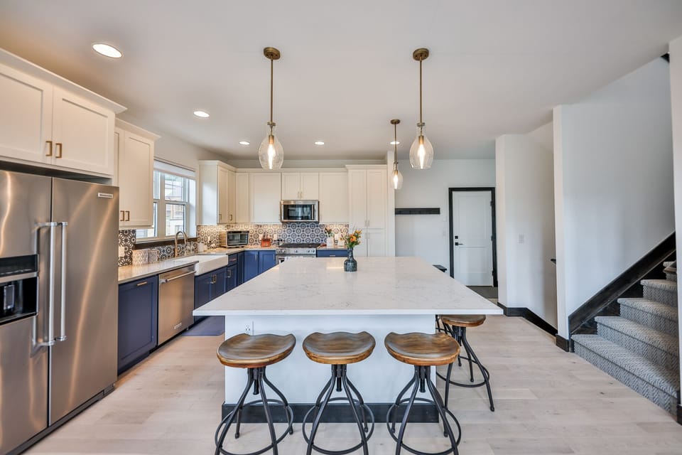 Large island with seating for 6. Sonos sound system makes gathering fun