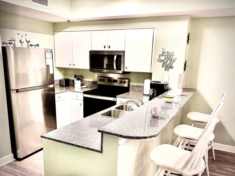 Kitchen with new stainless steel appliances. 