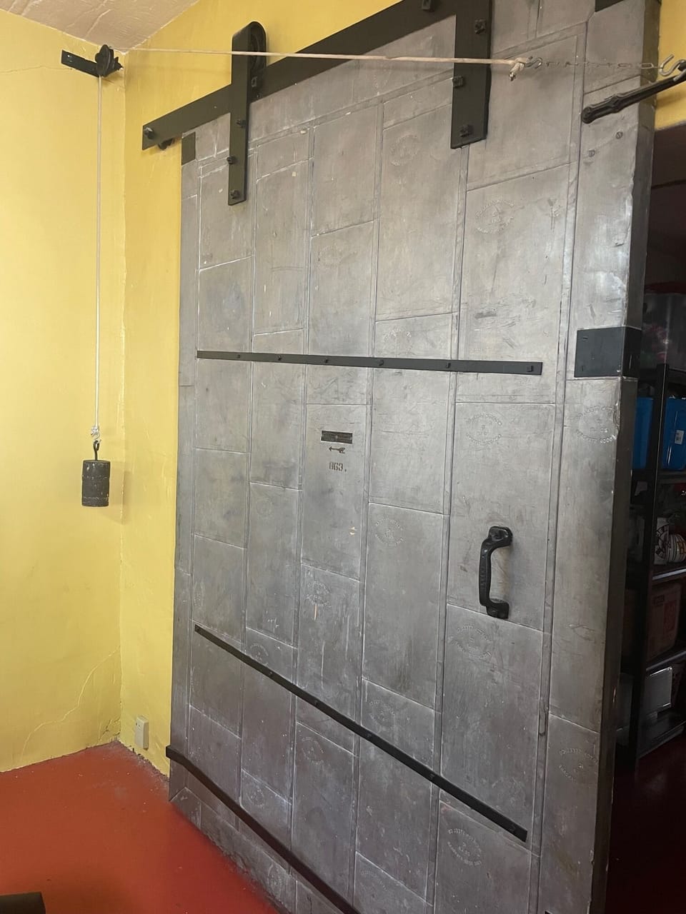 Industrial door in efficiency apartment.
