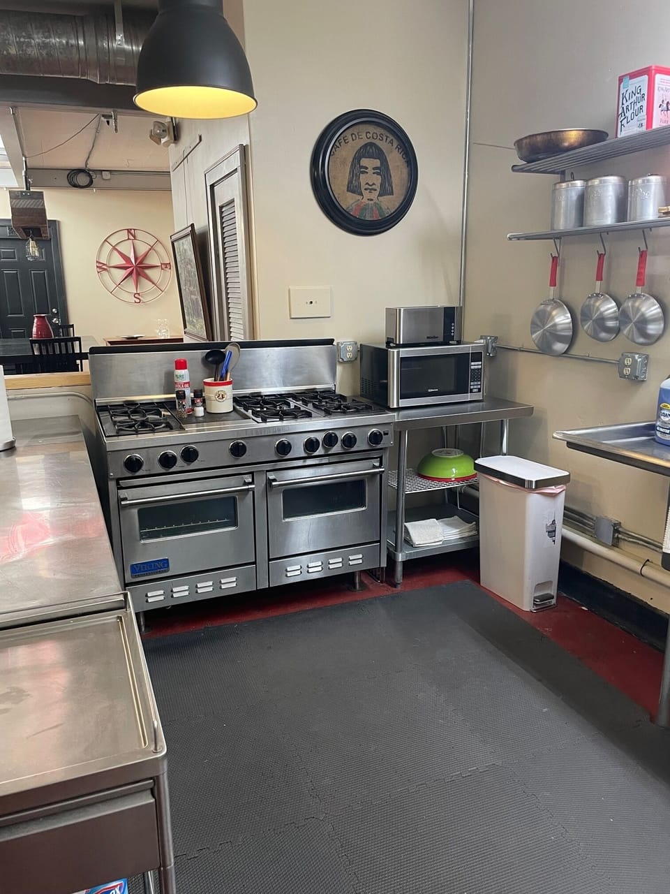 Kitchen features a Viking range, Subzero fridge, and commercial-grade sink. 