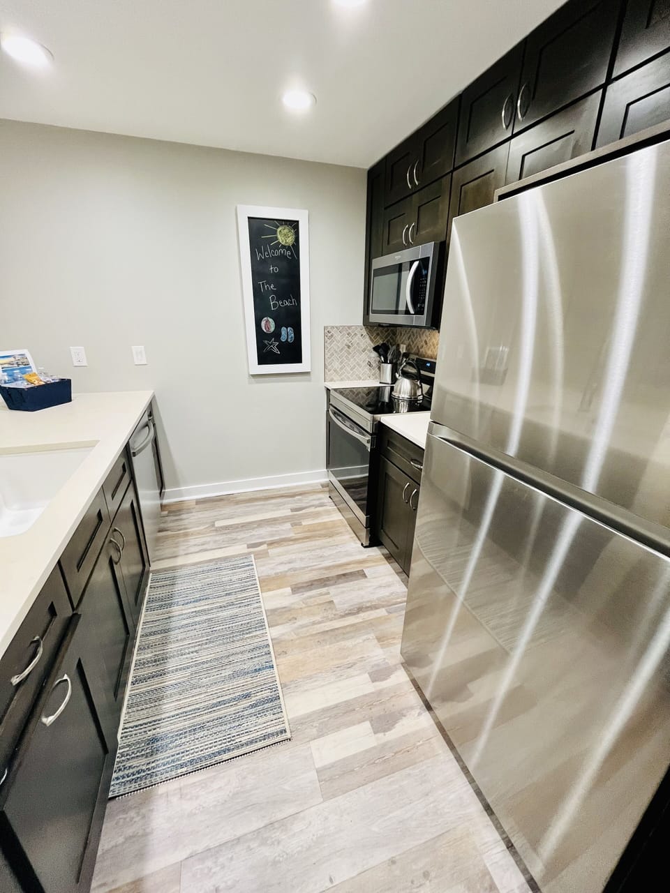 New Lighting and Luxury Vinyl Flooring Throughout Entire Villa. 
