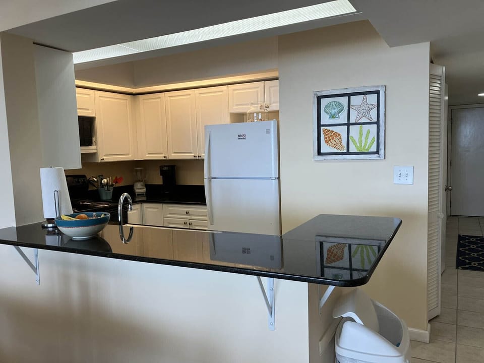 Kitchen has bar height counter