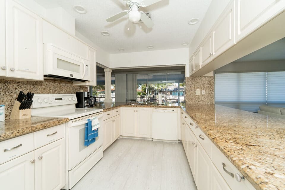 Wide open kitchen with extra seating bar stools
