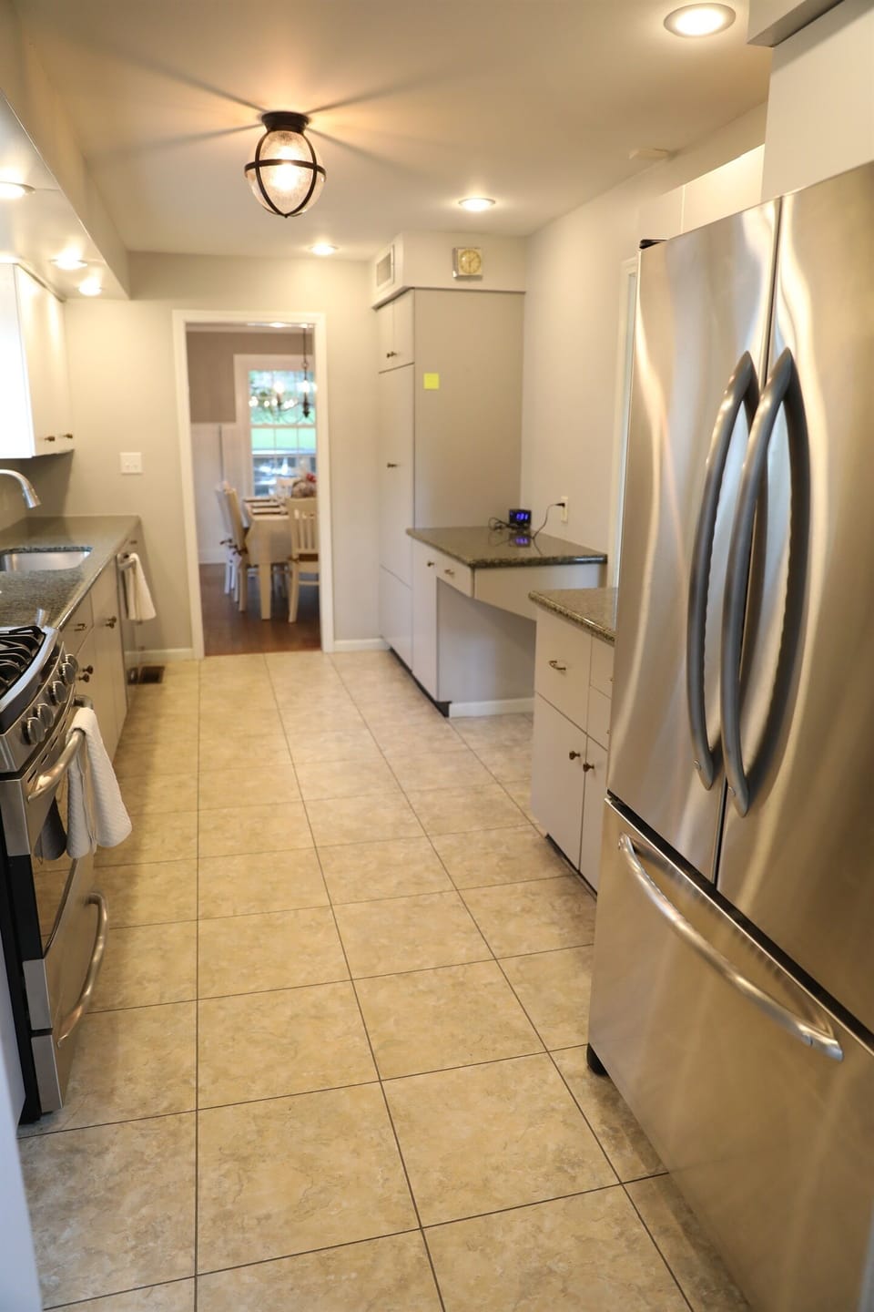 Kitchen showing stove, microwave, sink, dishwasher, pathway to dining room, pathway to dinette, fridge