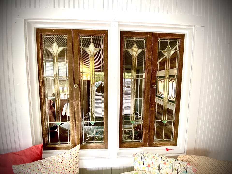 Antique Window Accents above Twin Bed