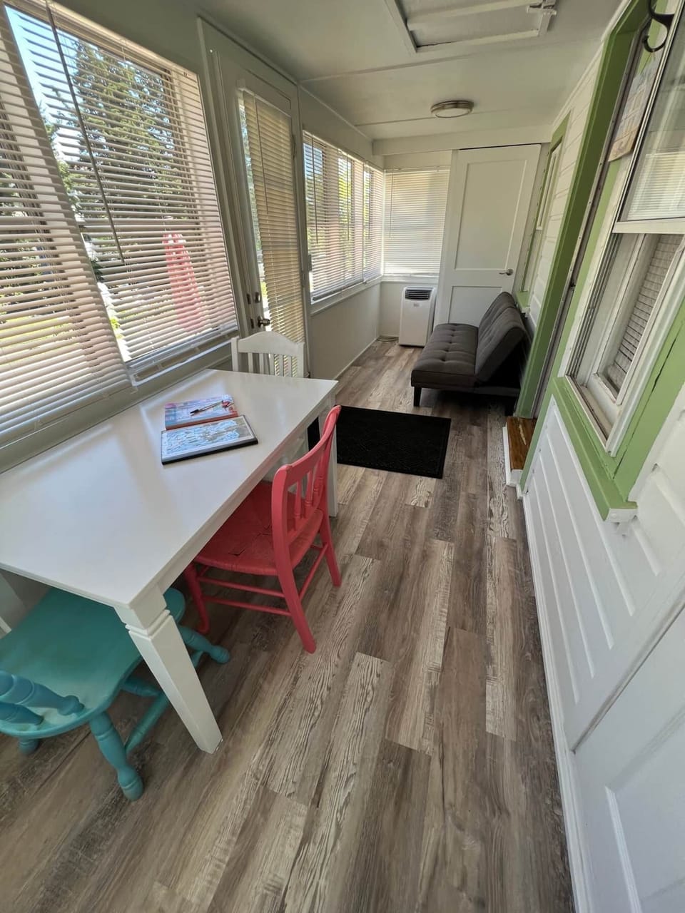 Enclosed porch with twin futon and A/C