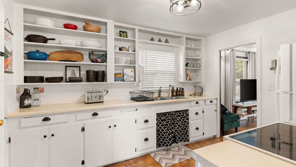 The kitchen is set up for cooking and has all dishes, pots and pans, utensils, spices, coffee, tea, and more!