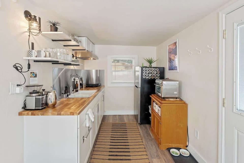 We have a good sized fridge and the essentials to make some good coffee. It is fully stocked so you will find dishes, pots and pans, and more!