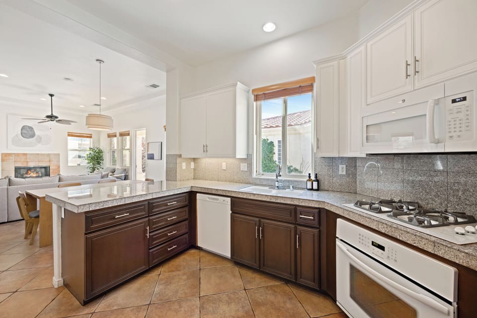 Granite counters and full-size appliances make cooking feel like a breeze here.