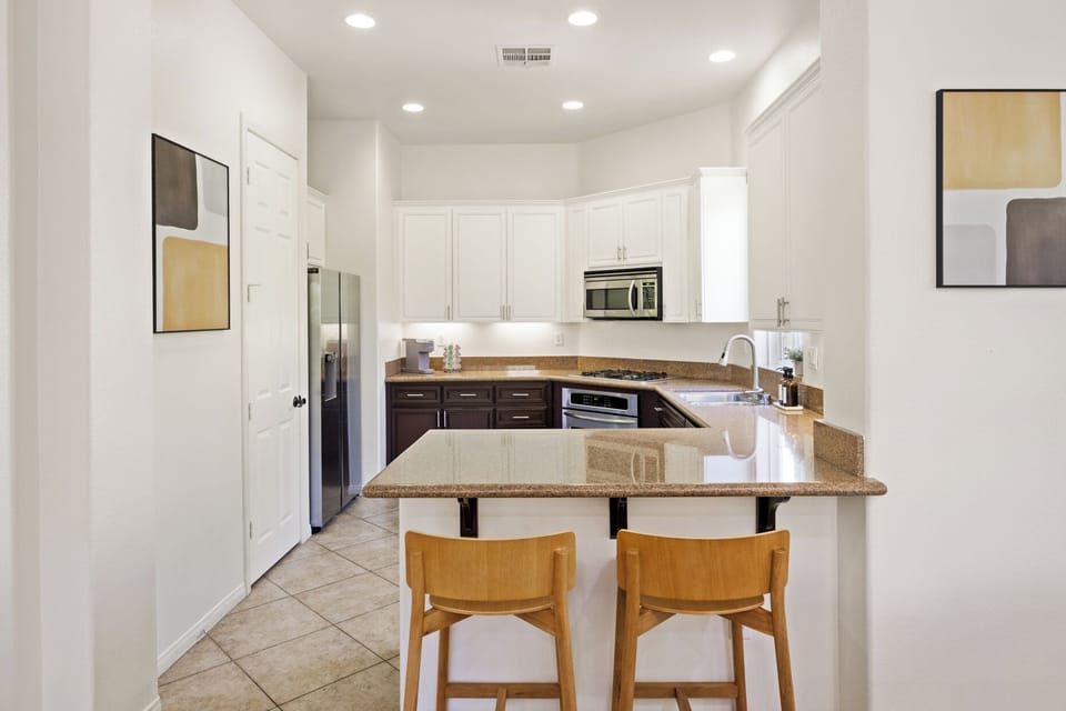 Grab a seat at the breakfast bar—quick bites or coffee chats happen right here daily.
