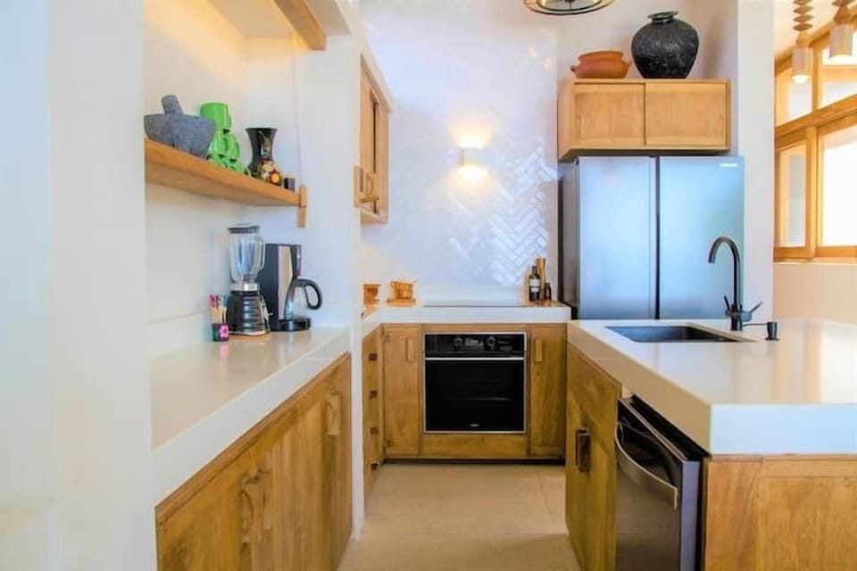 fully equipped kitchen with an oven