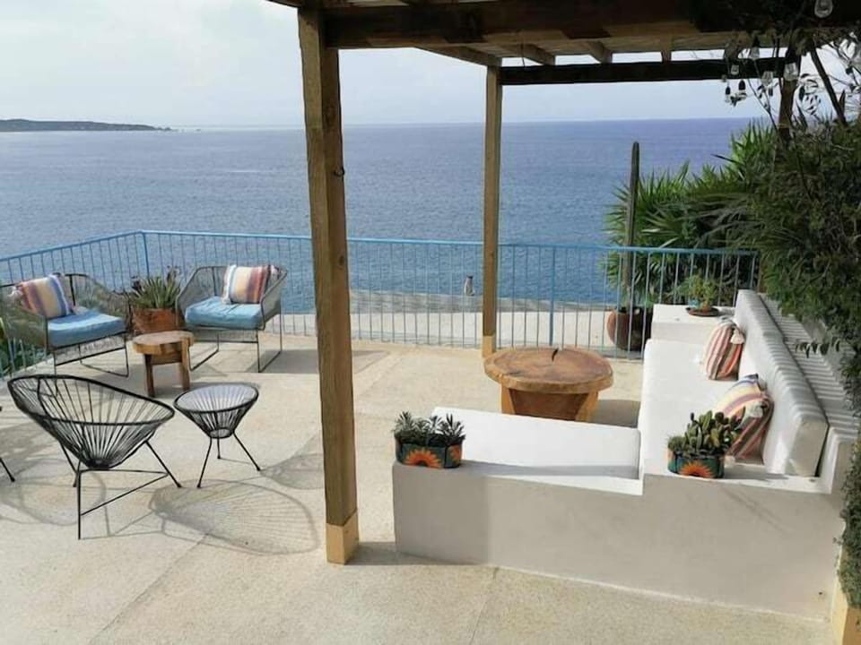 comfortable couch and plenty of seating with the amazing ocean view