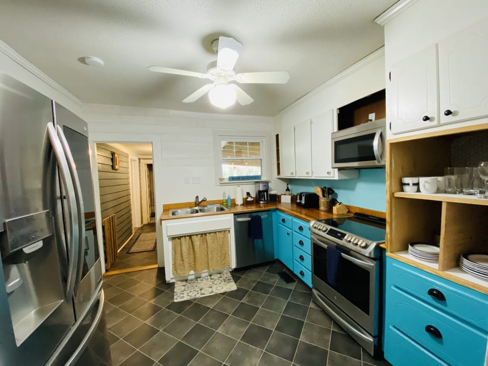 Fun vintage farmhouse kitchen with modern appliances. 