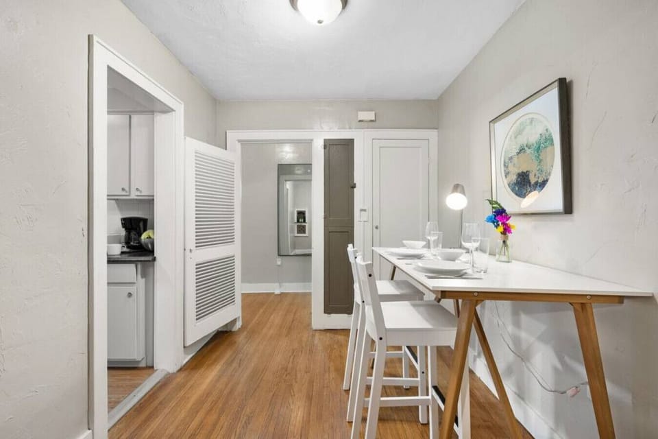 The dining room area for sharing your home-cooked meals. This angle shows the door leading to your kitchen.
