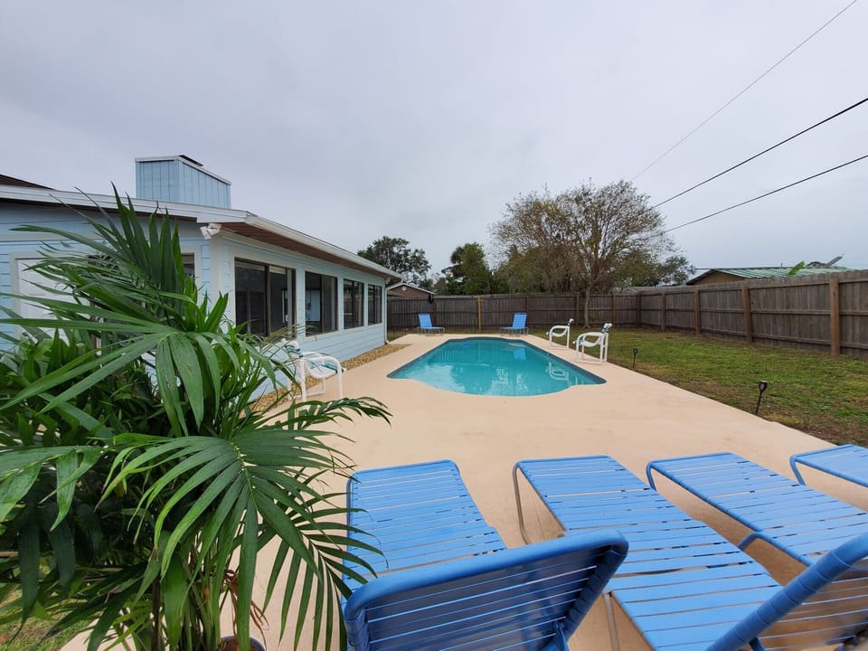 Pool area fenced in back yard for privacy & your pets