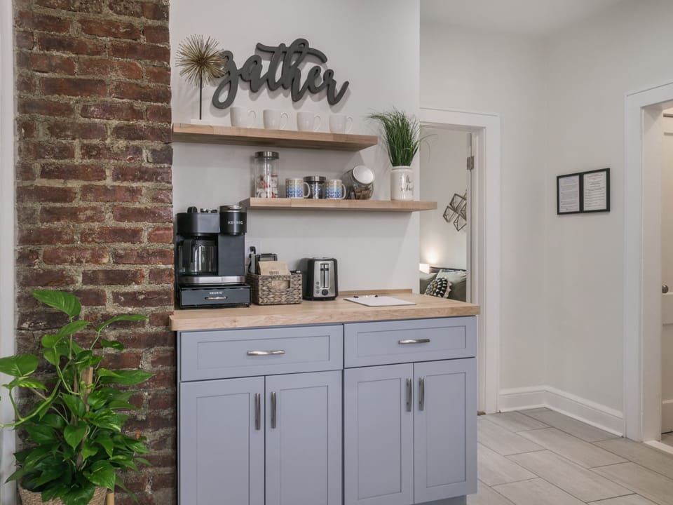 Coffee bar with complimentary coffee, tea, sugar, and creamers.