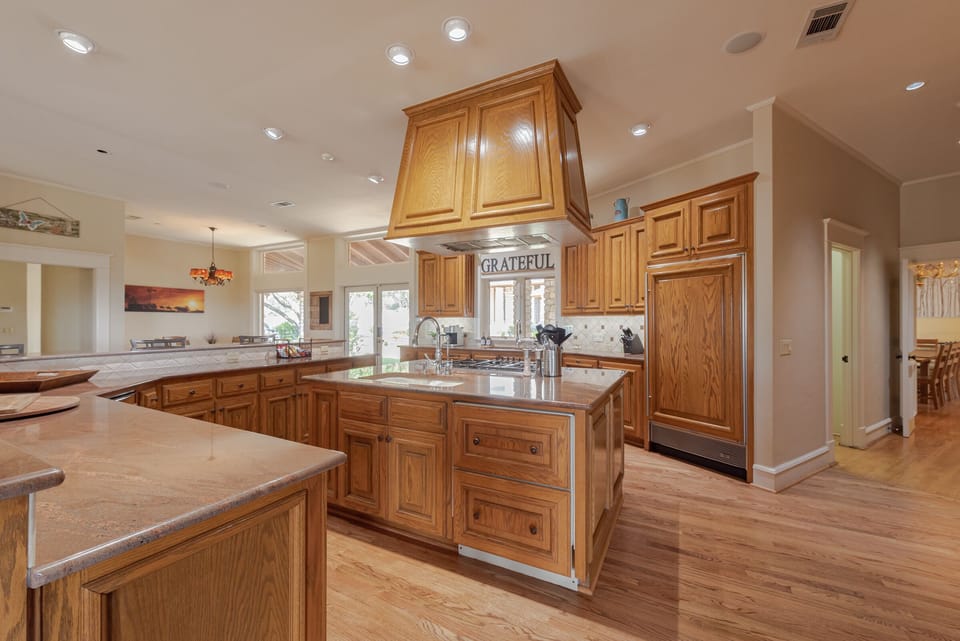 Gourmet Kitchen with high end appliances, double oven, two full size fridges 