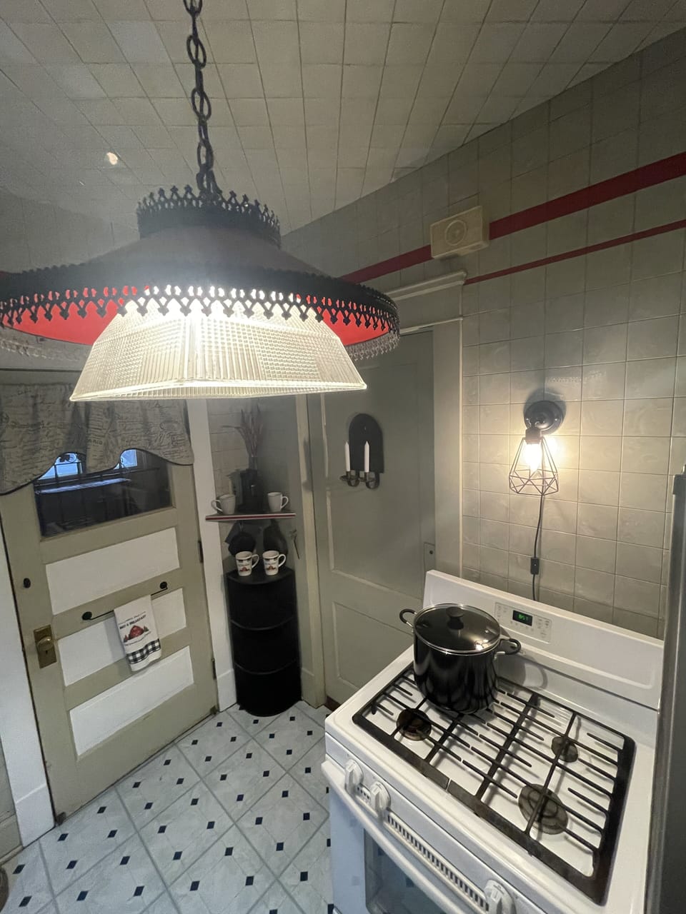 NE corner of 1st Fl kitchen w/gas stove, stainless fridge, microwave, Keurig etc