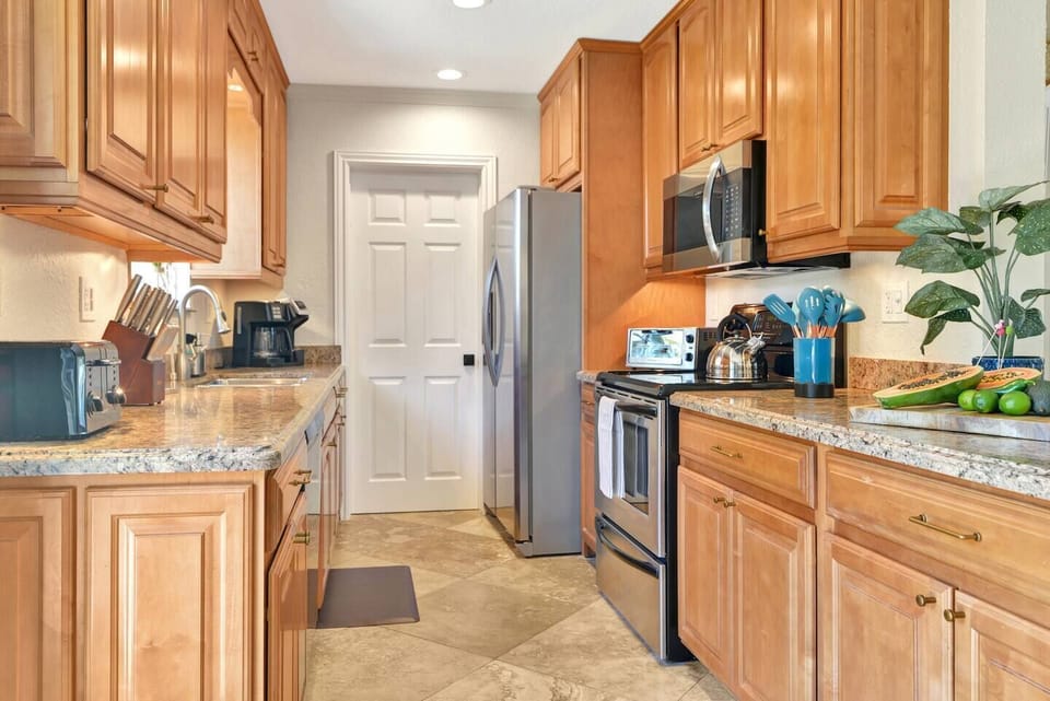 Galley kitchen that leads to bedroom 4 and the laundry room