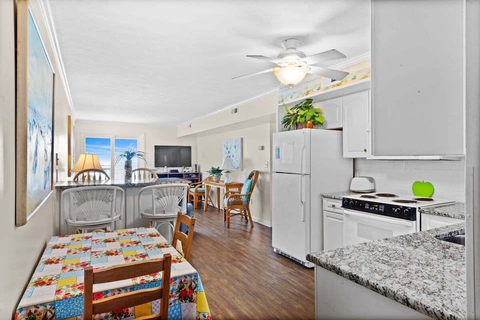 Quartz kitchen counters and a clean, updated cooking setup