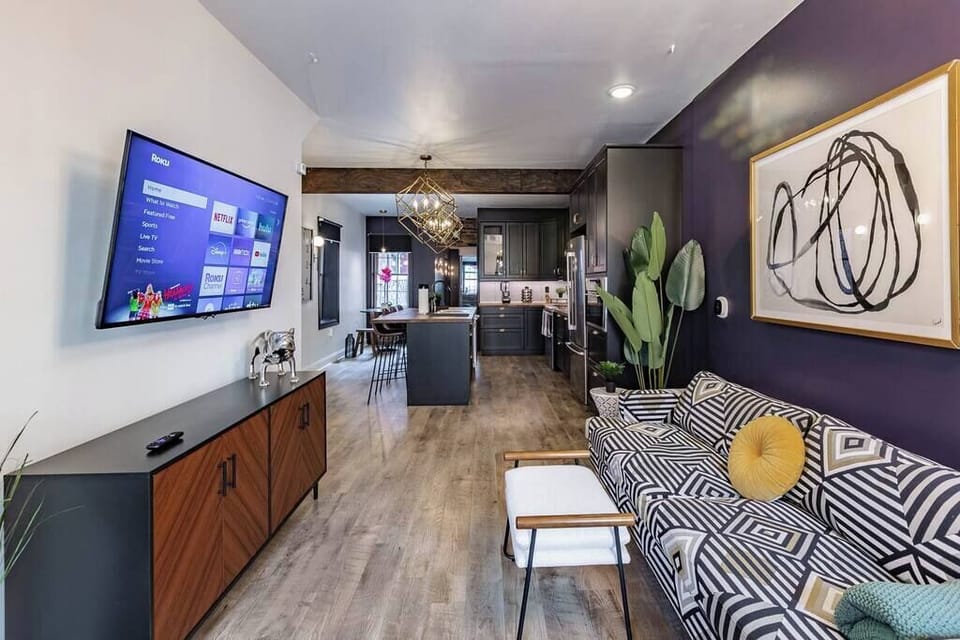 Discover a different perspective of our fancy living room, with direct access to the kitchen—an angle that showcases the seamless flow of sophistication and functionality in our space.