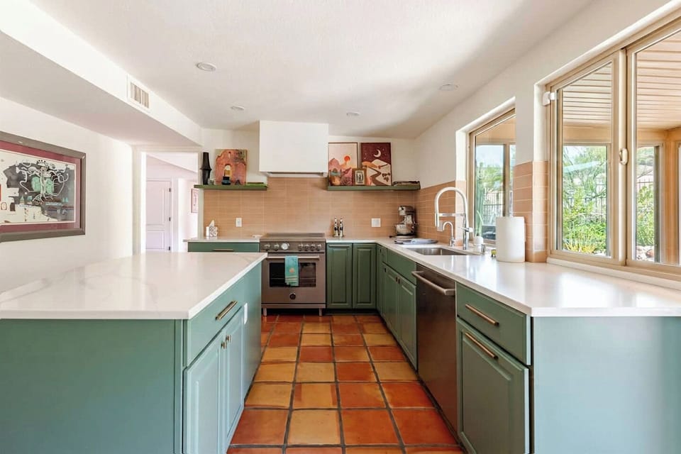 Make amazing meals & memories with the chef's kitchen that has a professional style induction range, Bosch dishwasher, and KitchenAid professional stand mixer.