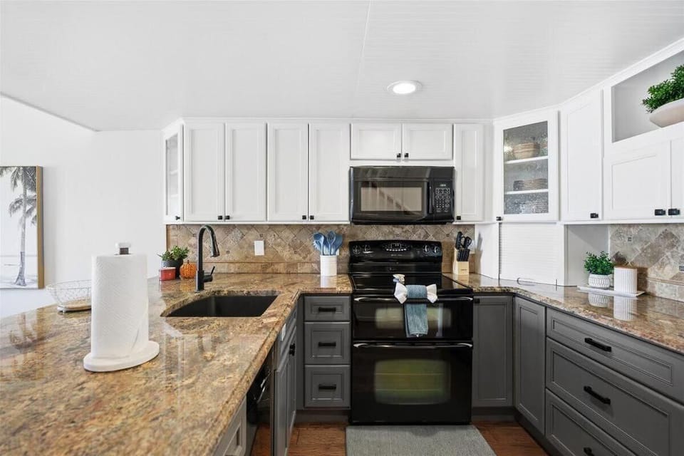Spacious kitchen with granite countertops and modern appliances