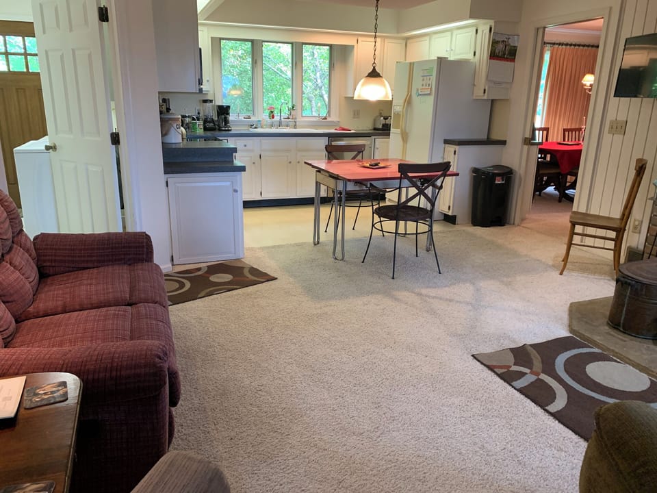 View from family room to laundry, kitchen and dining room.