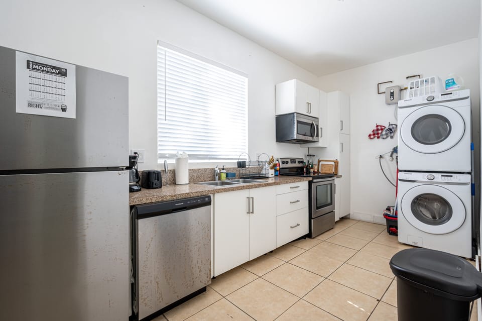 Full kitchen with fridge, dishwasher, range/oven, washer & dryer