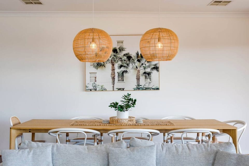 The living room diner area boasts a harmonious balance of style and practicality, making it an ideal spot for daily meals and social gatherings.