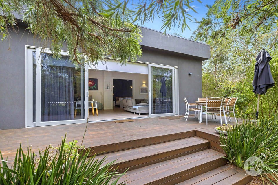 Large open deck area with views of native gardens