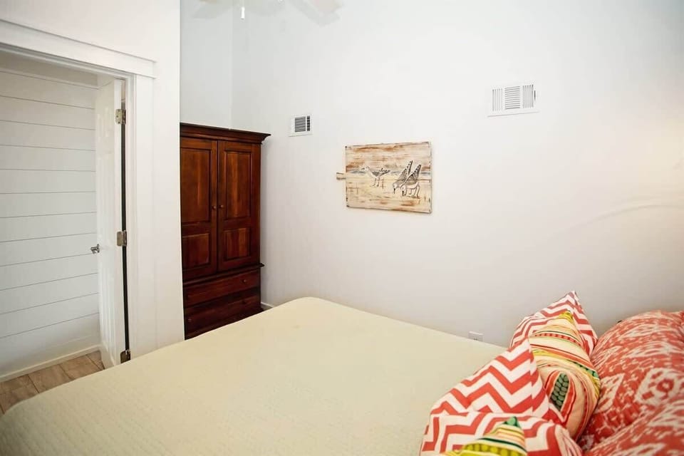 - Easygoing bedroom setup with just enough charm to make it feel like home right away - Wooden wardrobe gives you space to tuck things away without taking over the room - Calming colors and playful pillows create a spot to relax anytime
