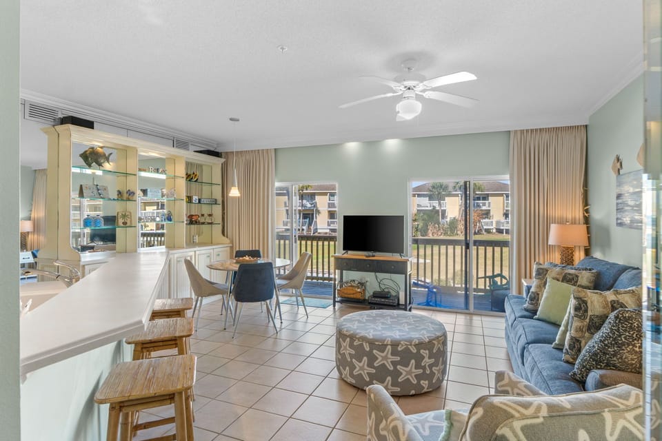 Your bright, open living space flows seamlessly from kitchen to comfortable seating, with balcony views creating the perfect retreat.