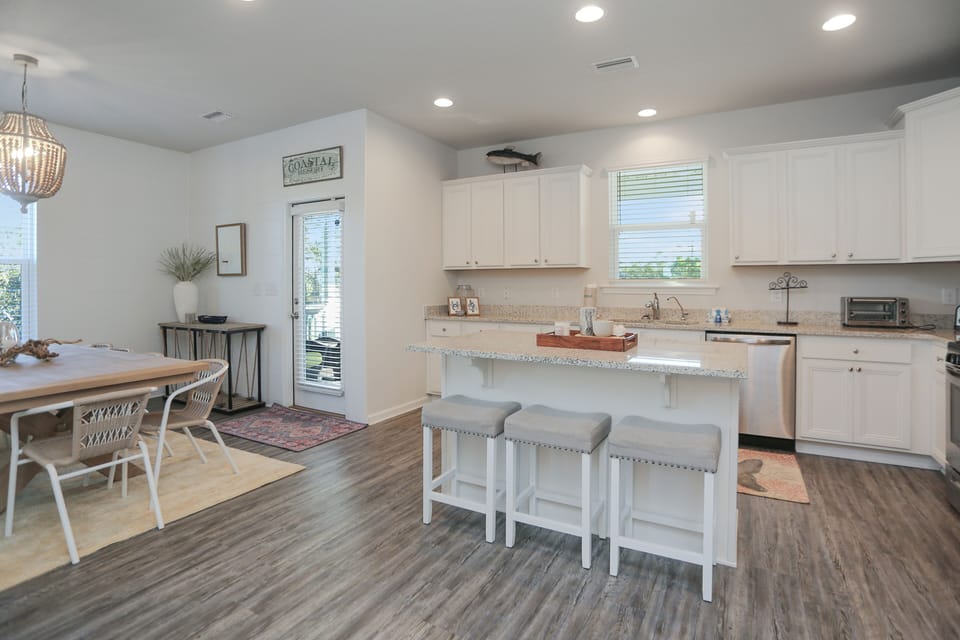 Kitchen with Bar Seating & Dining Area